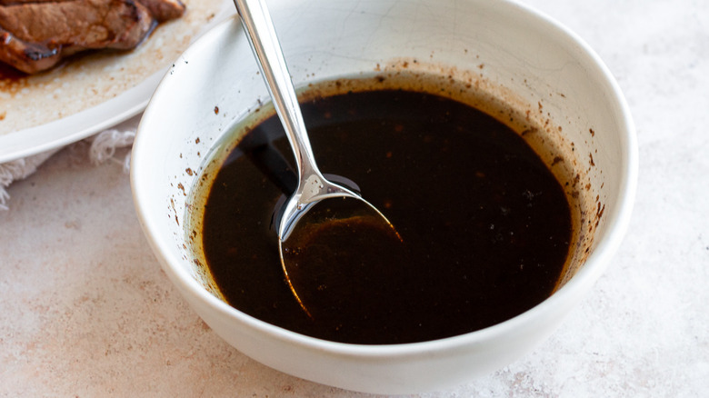 steak marinade in bowl with spoon
