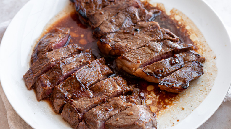 cooked marinated steak on plate