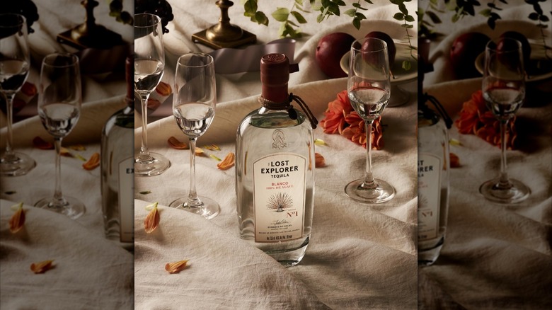 A bottle of The Lost Explorer blanco on a white tablecloth