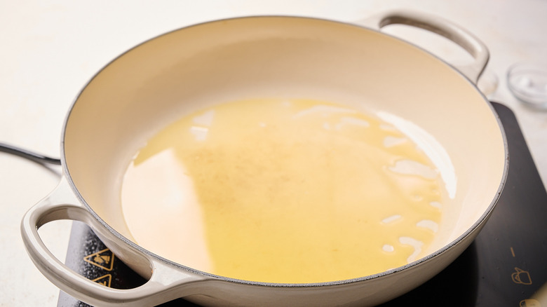 heating oil in a skillet