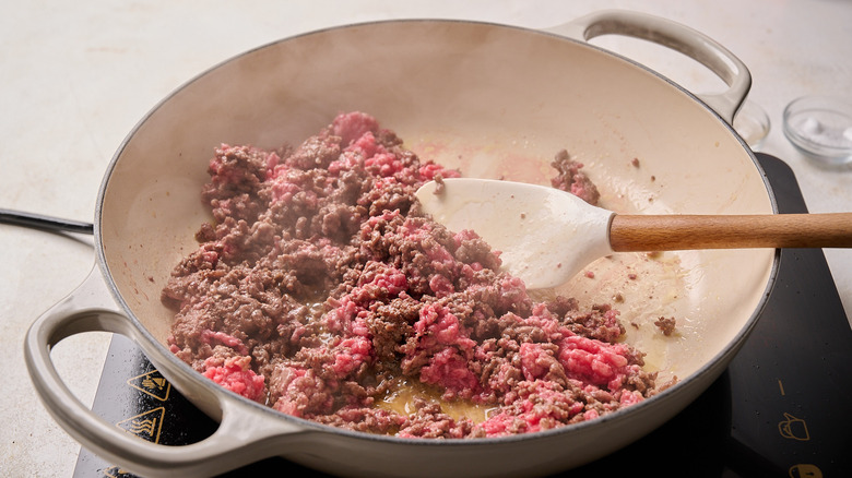 crumbling beef in a skillet