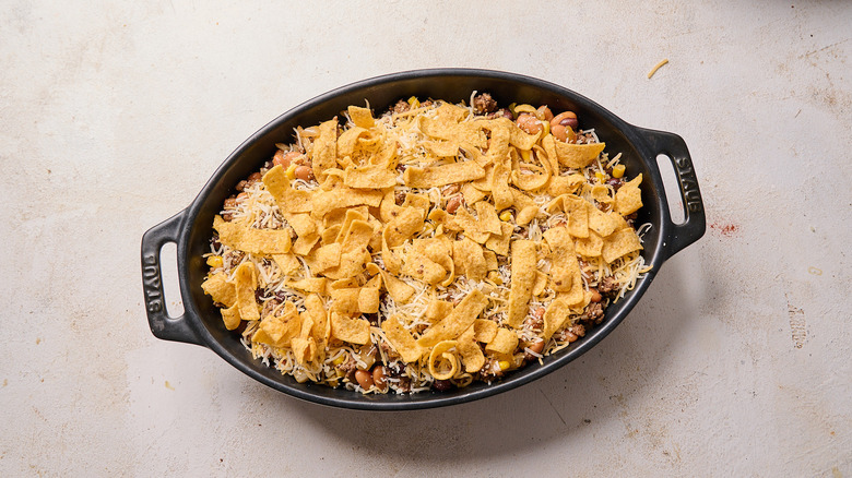 fritos spread across casserole dish