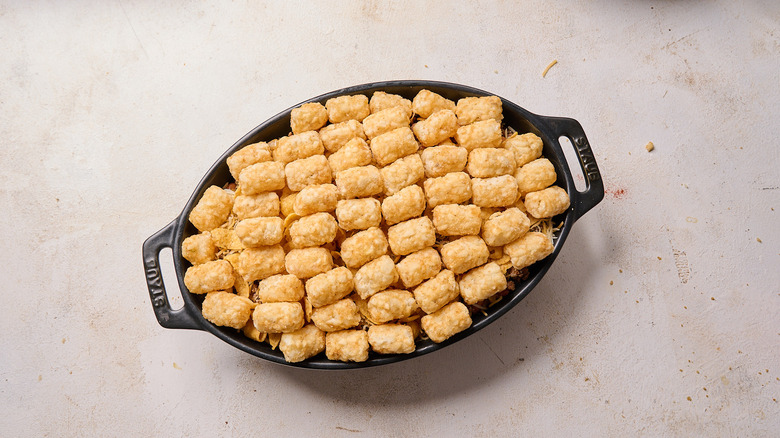 tater tots arrange on top of casserole