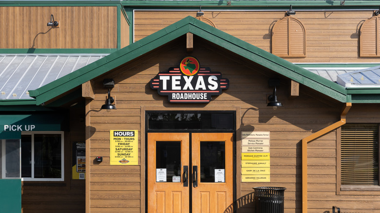 Texas Roadhouse sign on restaurant building during daytime