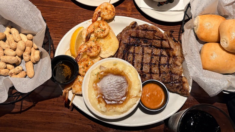 Texas Roadhouse dishes including steak, grilled shrimp, mashed potatoes, and rolls
