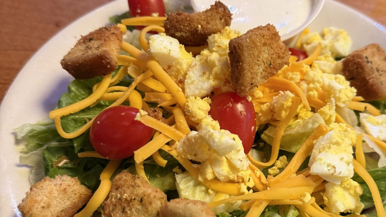 Texas Roadhouse salad topped with croutons