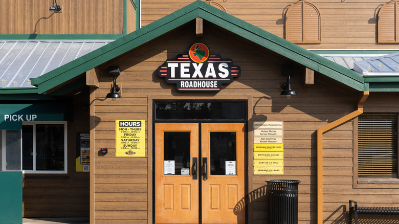 The entrance to a Texas Roadhouse during the day