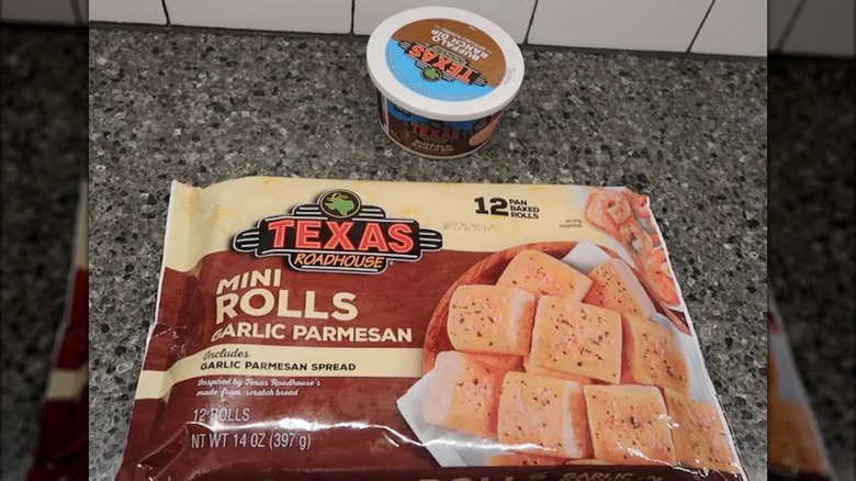 Texas Roadhouse buffalo dip and garlic parmesan rolls on the counter