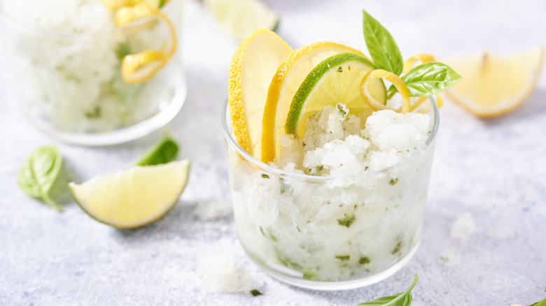 granita in serving glass with citrus garnish
