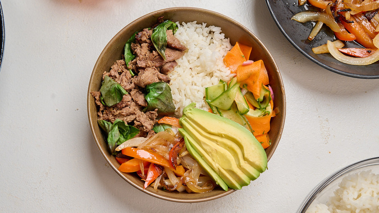 cucumber and avocado in a basil beef bowl