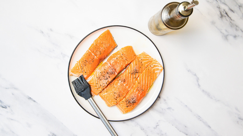 Seasoned salmon with salt and pepper.