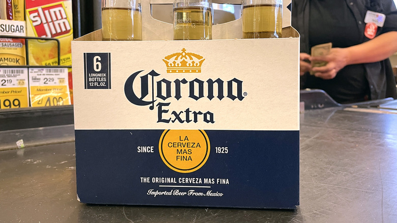 Beer 6-pack on grocery conveyor belt
