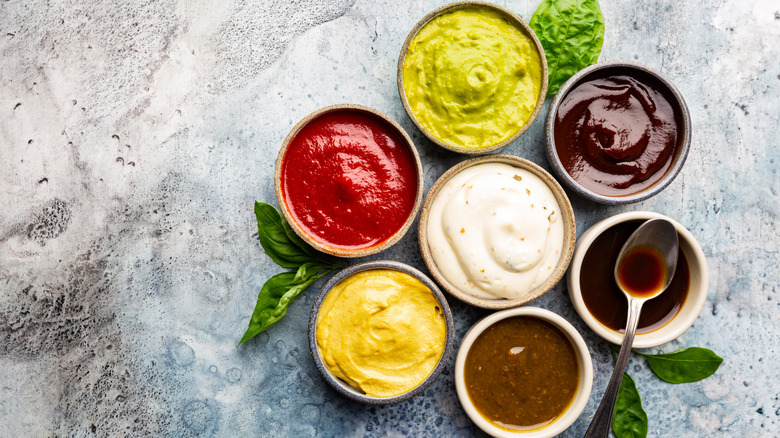 An assortment of flavorful dips in bowls