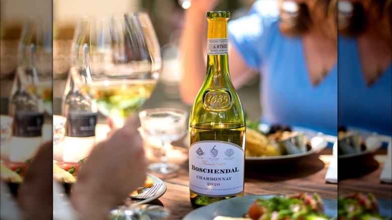 bottle of Boschendal The 1685 Collection Chardonnay with glass and food