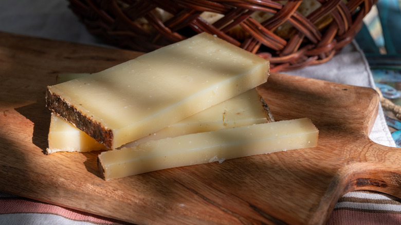 big pieces of Comté on a cutting board