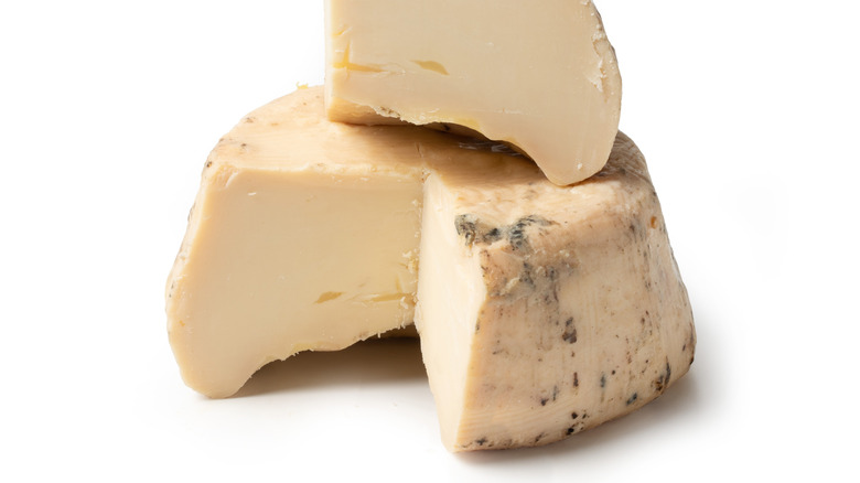 round of ricotta salata with big triangle piece cut out