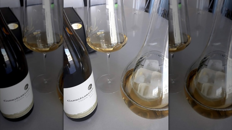 wine bottle, glass, and decanter with white wine