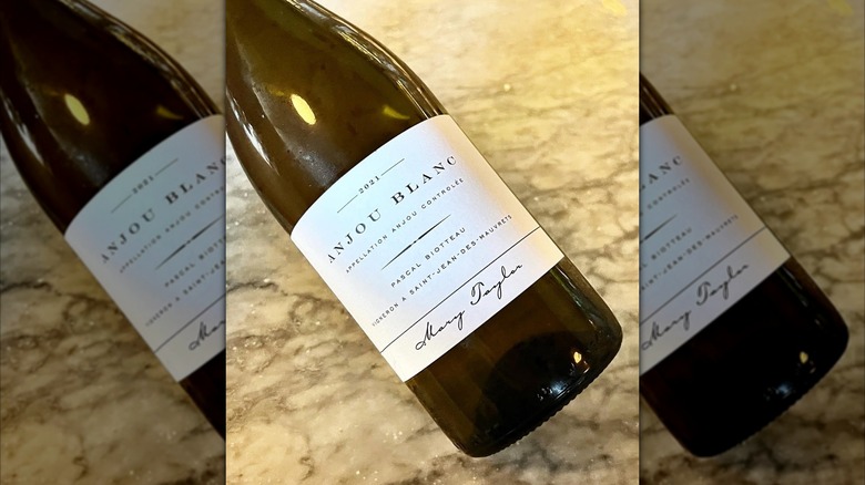 bottle of white wine on its side