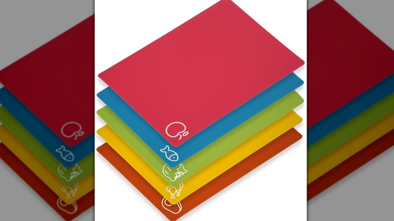 A set of 5 boards shown with their related food symbols on a plain white background