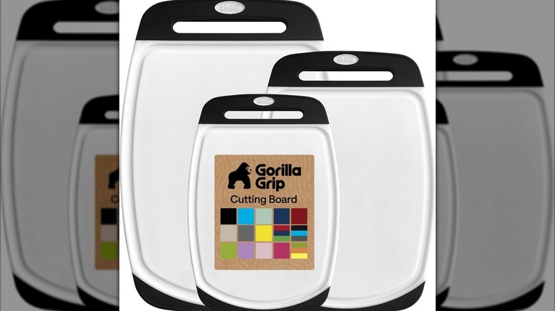 A close up of the Gorilla Grip cutting board showcasing its handle and juice grooves