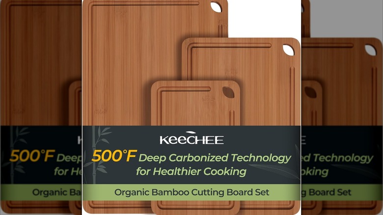An overhead shot of the three sizes of cutting boards on a countertop surrounded by food