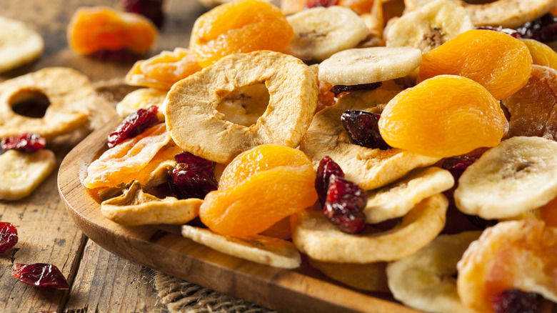 Colorful dried fruit arranged on plate