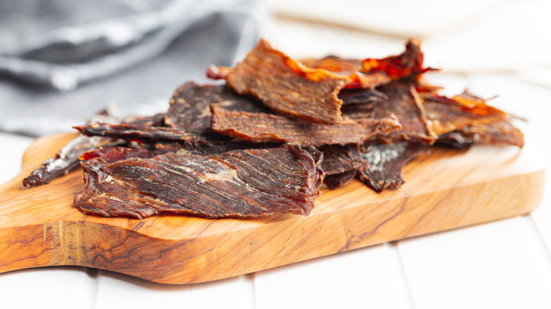Beef jerky on wooden cutting board