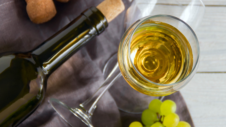 wine bottle, glass, and grapes top view