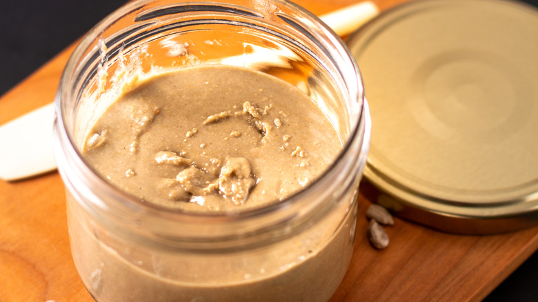 Close up of sunflower butter in glass jar