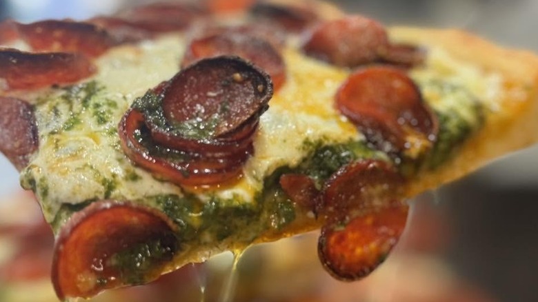 Sliced of spicy pepperoni pizza at Carluccio's