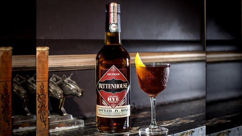 Bottle of Rittenhouse Bottled-in-Bond with cocktail