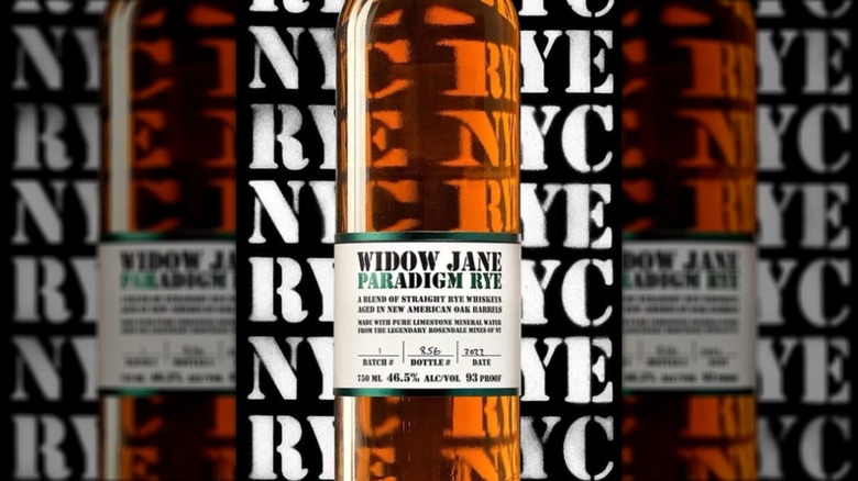 Bottle of Widow Jane Paradim Rye with block letter background