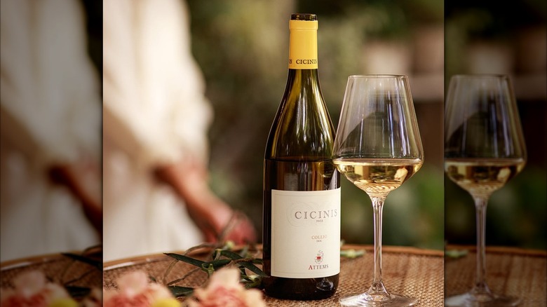 bottle of white wine with glass
