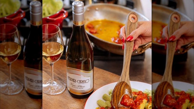 bottle and glass of white wine with food
