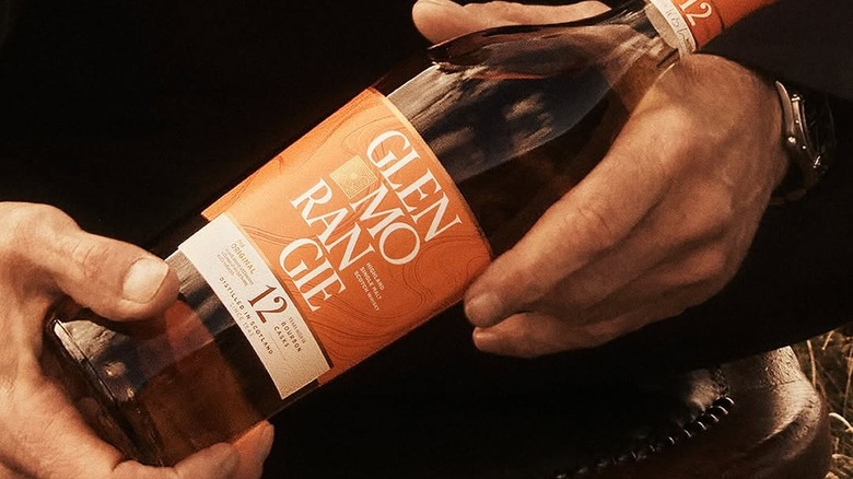 A bottle of the new Glenmorangie 12-year held in a person's hands
