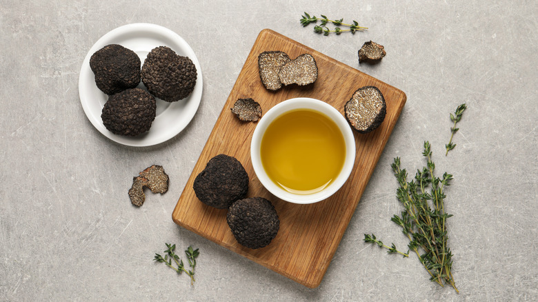 Fresh truffles and olive oil on a table