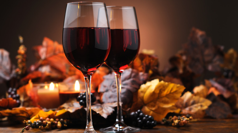red wine glasses with leaves
