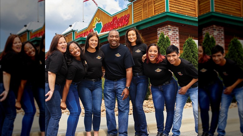 Texas Roadhouse employees lined up outside a restaurant