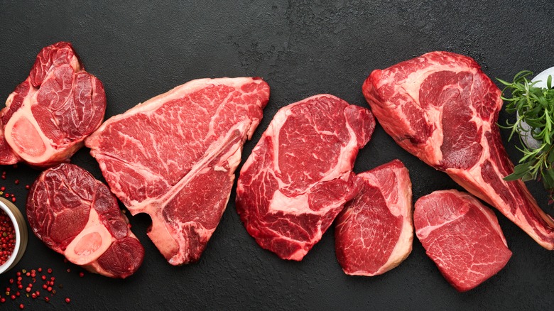 Various different raw steak cuts.