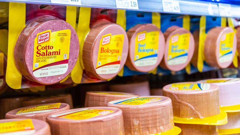 Assortment of Ocasr Mayer deli meats in case at grocery store
