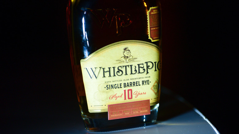 Close up of Whistlepig Rye label against black background.