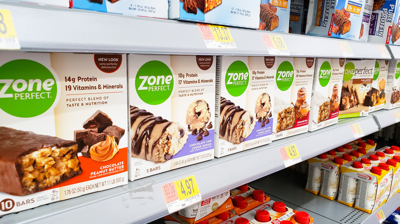Close up of Zone Perfect protein bars on a grocery store shelf