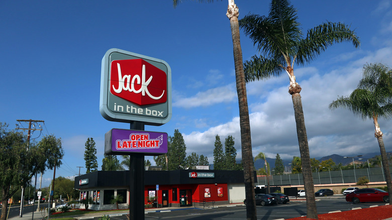 Jack in the Box sign with restaurant exterior and parking lot