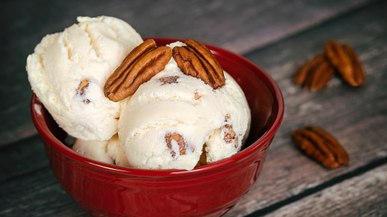 Butter pecan ice cream in a red bowl
