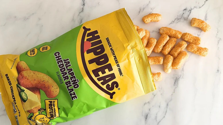 Hippeas Jalapeño Cheddar Blaze on marble surface
