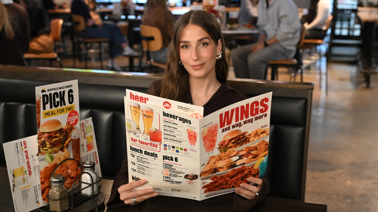 Woman eating at Buffalo Wild Wings