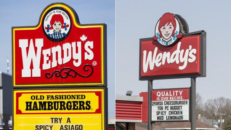 Wendy's fries container in bright red with the Wendy's logo, placed on a table in front of a Wendy's paper bag featuring the iconic Wendy's character.