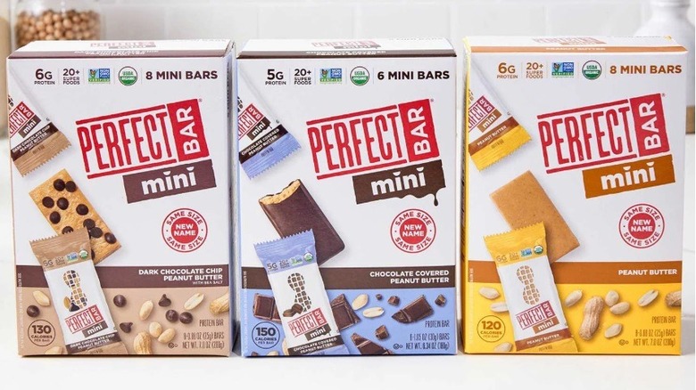 Three boxes of Perfect Bar Minis of varying flavors on kitchen counter