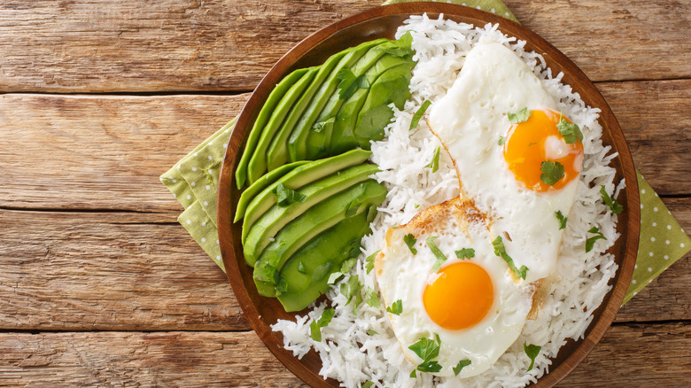 rice bowl with eggs and avocado