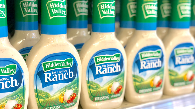 Bottles of Hidden Valley Ranch dressing on a grocery store shelf